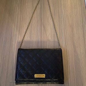 Marc Jacobs black and gold bag.